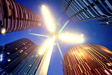 Low angle composition with LED lamp post and futuristic architecture at Sanlitun SOHO at night, Beijing, China, Asia