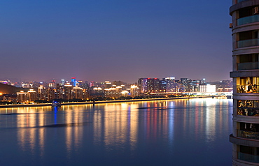 Beautifully illuminated high rises on Qiantang River in Hangzhou, Zhejiang province, China, Asia