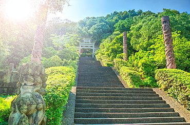 Steps flanked by stone pillars and Qi Ling lions leading up towards a stone gate, Zhejiang, China, Asia