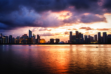 Dramatic clouds over Qianjiang River with skyline of Hangzhou's new business district, Hangzhou, Zhejiang, China, Asia