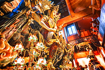 GuanYin Buddha at Yong Fu Temple with rich decorations in a wide angle perspective, Hangzhou, Zhejiang, China, Asia 