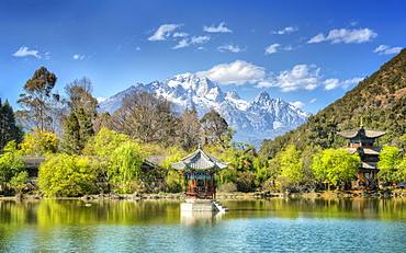 Pagodas with Yu Long Xue Shan (Jade Dragon Snow Mountain) in Jade Spring Park in spring, Lijiang, Yunnan, China, Asia 