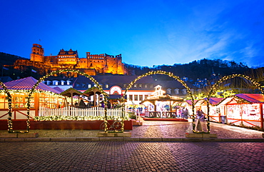 Christmas Market at Karlsplatz in the old town of Heidelberg, with Castle Heidelberg, Heidelberg, Baden-Wurttemberg, Germany, Europe 