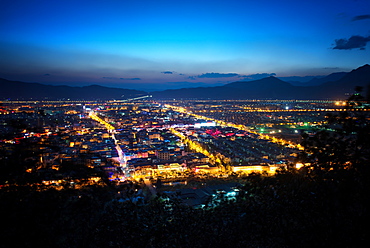 City lights of Lijiang as seen from Elephant Mountain, Lijiang, Yunnan, China, Asia 