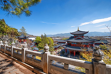 An elevated view on Mu Fu and the Old Town of Lijiang with white marble balustrades, UNESCO World Heritage Site, Lijiang, Yunnan, China, Asia 