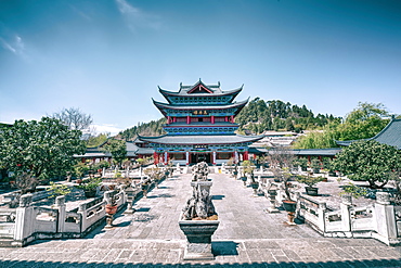 Wanjuan Pavilion, one of the main buildings at Mufu Wood Mansion with potted bonsai and rocks, Lijiang, Yunnan, China, Asia 