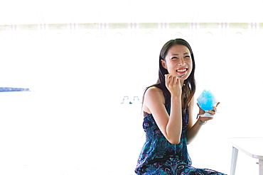 Portrait of a Japanese woman eating shaved ice