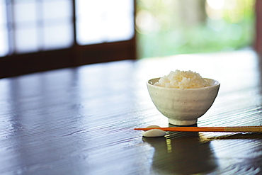 Bowl Of Rice And Chopsticks