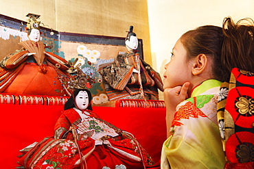 Young Japanese Girl with Traditional Hina Ningyo (Dolls)