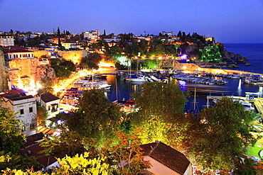 Boats moored in Old Town harbour at night in Antalya, Turkey