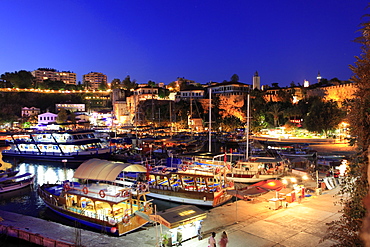 Boats moored in Old Town harbour at night in Antalya, Turkey