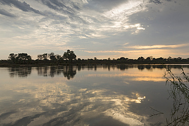 A view from the Ndhovu Safari Lodge reflected in the Okavango, Caprivi, Namibia