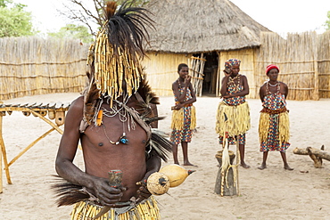 The medicine man at the visitor village Lizauli showing the visitors the culture of the Caprivians, Namibia