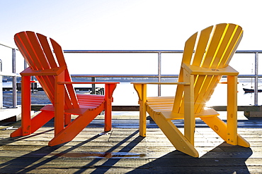 Red and yellow chair on deck at Halifax Regional Municipality, Nova Scotia, Canada