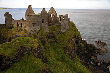 View of Dunluce Castle and Atlantic Ocean in Ireland, UK