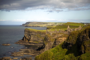 View of Dunluce Castle on cliffs and Atlantic Ocean in Ireland, UK