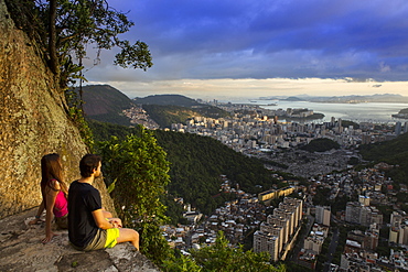 Hikers looking out over Rio from the Morro dos Cabritos, Rio de Janeiro, Brazil, South America