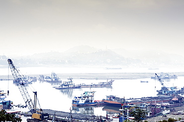 View of industrial boats on the Ayeyarwady River (Irrawaddy) river, Sagaing, Myanmar (Burma), Southeast Asia