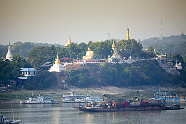 View of buddhist temples on Sagaing hill and the Irrawaddy or Ayeyarwady river from the Mandalay side of the river, Sagaing, Myanmar (Burma), Southeast Asia