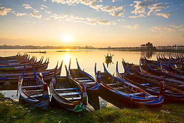 Boats on the Taungthaman Lake near Amarapura with the U Bein teak bridge behind, Mandalay, Myanmar (Burma), Southeast Asia