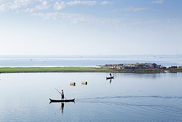 Duck farmers herding ducks on Taungthaman Lake near Amarapura, Mandalay, Myanmar (Burma), Southeast Asia