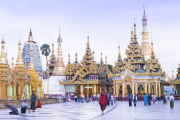 Devotees paying obeisance at the Shwedagon pagoda complex in Yangon (Rangoon), Myanmar (Burma), Southeast Asia