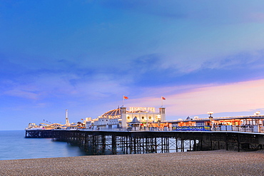 The Palace Pier (Brighton Pier) at dusk, Brighton, East Sussex, England, United Kingdom, Europe