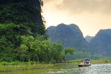 Boats in the karst landscapes of Tam Coc and Trang An in the Red River area , UNESCO World Heritage Site, Ninh Binh, Vietnam, Indochina, Southeast Asia, Asia