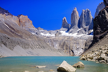 A glacial lake and the rock towers that give the Torres del Paine range its name, Torres del Paine National Park, Patagonia, Chile, South America