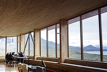 Tourists sitting in the lounge area of the Tierra Patagonia Hotel in the Torres del Paine region, Patagonia, Chile, South America