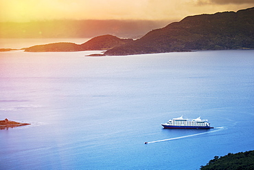 View of Wulaia Bay, Isla Navarino, Murray Channel, with the Stella Australis cruise ship, Patagonia, Chile, South America