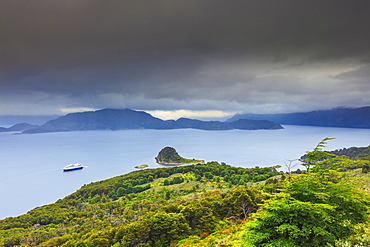 Vew of Wulaia Bay, Isla Navarino, Murray Channel, with the Stella Australis cruise ship, Patagonia, Chile, South America