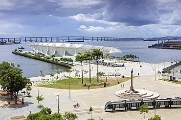 The Museum of Tomorrow, architect Santiago Calatrava, Porto Maravilha area and Niteroi Bridge with the VLT tram in the foreground, Rio city centre, Rio de Janeiro, Brazil, South America 