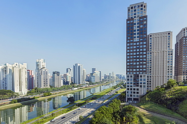 Traffic on Marginal Pinheiros urban highway, the Pinheiros Rriver and skyline of new business centre on Rua Berrini in Brooklin, Sao Paulo, Brazil, South America