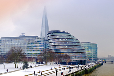 The South Bank of the River Thames showing the Shard and City Hall, HQ of the Mayor of London, in snow, London, England, United Kingdom, Europe