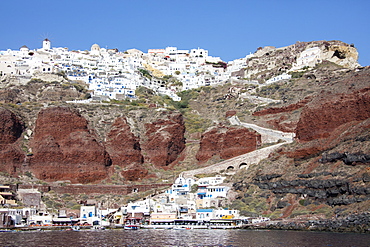 Typical Greek village perched on volcanic rock with white and blue houses and windmills, Santorini, Cyclades, Greek Islands, Greece, Europe