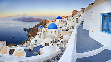 White houses and blue domes of the churches dominate the Aegean Sea, Oia, Santorini, Cyclades, Greek Islands, Greece, Europe