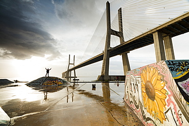 The colorful murals around Vasco Da Gama bridge emphasize its architecture and atmosphere at dawn, Lisbon, Portugal, Europe