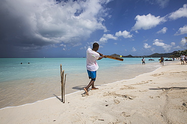 Kids playing on the beach surrounded by the turquoise Caribbean sea, The Nest, Antigua, Antigua and Barbuda, Leeward Islands, West Indies, Caribbean, Central America