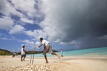 Kids playing on the beach surrounded by the turquoise Caribbean sea, The Nest, Antigua, Antigua and Barbuda, Leeward Islands, West Indies, Caribbean, Central America