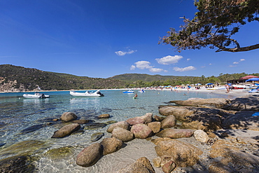 Boats in the turquoise sea surround the sandy beach of Cala Pira Castiadas, Cagliari, Sardinia, Italy, Mediterranean, Europe