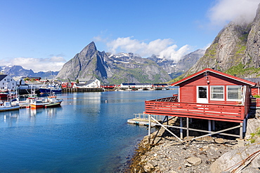 Fishing village and harbour framed by peaks and sea, Hamnoy, Moskenes, Nordland county, Lofoten Islands, Arctic, Northern Norway, Scandinavia, Europe