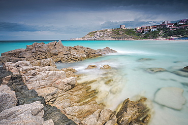 Storm clouds frame the village overlooking the turquoise sea, Santa Teresa di Gallura, Province of Sassari, Sardinia, Italy, Mediterranean, Europe