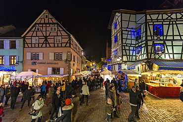 Tourists and Christmas Markets in the old medieval town of Riquewihr, Haut-Rhin department, Alsace, France, Europe