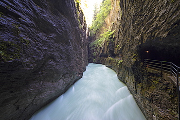 Water of creek flows in the narrow limestone gorge carved by river, Aare Gorge, Bernese Oberland, Canton of Berne, Switzerland, Europe