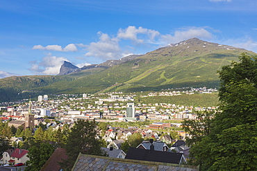 Bell tower and houses of the city surrounded by rocky peaks and green hills, Narvik, Ofotfjorden, Nordland, Norway, Scandinavia, Europe