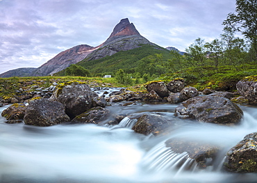 Waterfall frames the Stetinden mountain peak illuminated by midnight sun, Tysfjord, Nordland, Norway, Scandinavia, Europe