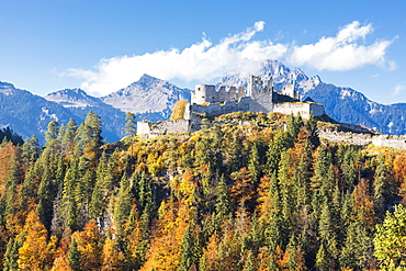 View of the old Ehrenberg Castle surrounded by colorful woods and rocky peaks, Reutte, Austria, Europe