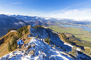 Climbers on steep crest covered with snow in the Ammergau Alps, Tegelberg, Fussen, Bavaria, Germany, Europe