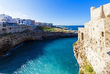 Turquoise sea framed by the old town perched on the rocks, Polignano a Mare, Province of Bari, Apulia, Italy, Europe